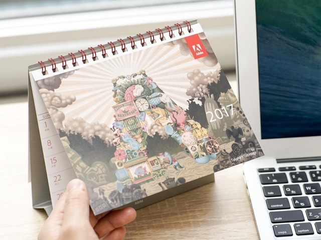 CNET Japanでは、関係各社様からたくさんの2017年カレンダーをいただきました。そこで、いただいたカレンダーの中から、特にデザインや仕掛けがユニークだったものを編集部でセレクトして毎日紹介していきます。今回は、美麗な写真・グラフィックを使用したものや、デザイン性が高いカレンダーを中心に紹介します。まずは、「Illustrator CC」や「Photoshop CC」などで有名なデザインツールを提供するアドビシステムズから。