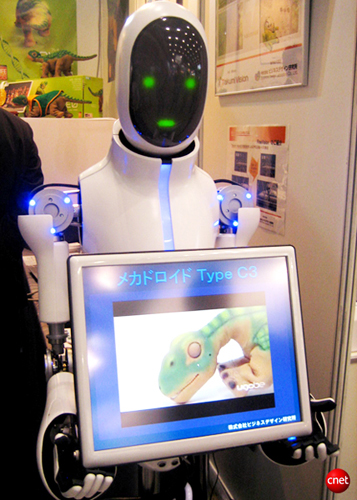 　ビジネスデザイン研究所の受付ロボット「メカドロイドType C3」。顔認証技術を搭載して来客を誘導し、音声、表情、タッチディスプレイを利用する。