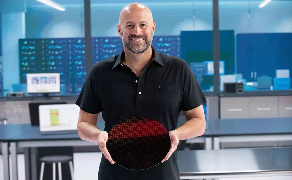 Gregory Bryant, leader of Intel's PC chip business, holds a 300mm wide wafer with hundreds of Tiger Lake processors.