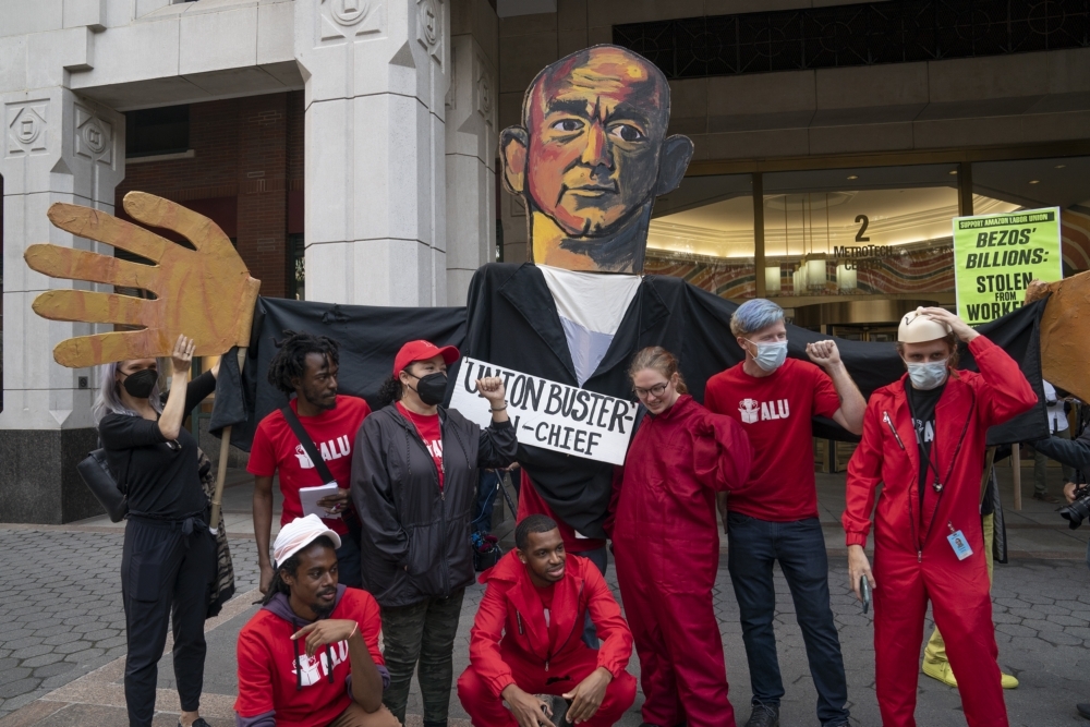 Supporters of organizing a union at an Amazon Staten Island warehouse rally in front of a National Labor Relations Board field office last year, with an effigy of Amazon founder Jeff Bezos.