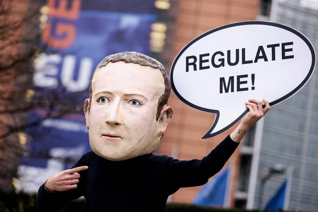 An activist in Brussels in 2020, when the EU first unveiled plans for the Digital Services Act. The mask depicts Mark Zuckerberg, founder of Facebook and CEO of parent company Meta.