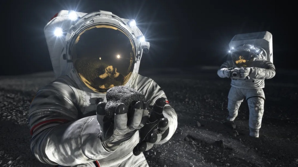 宇宙服を着て月面で作業する2人の飛行士のイラスト。手前の飛行士は岩を拾い上げて調べており、もう1人はこの岩を採集した場所を撮影している