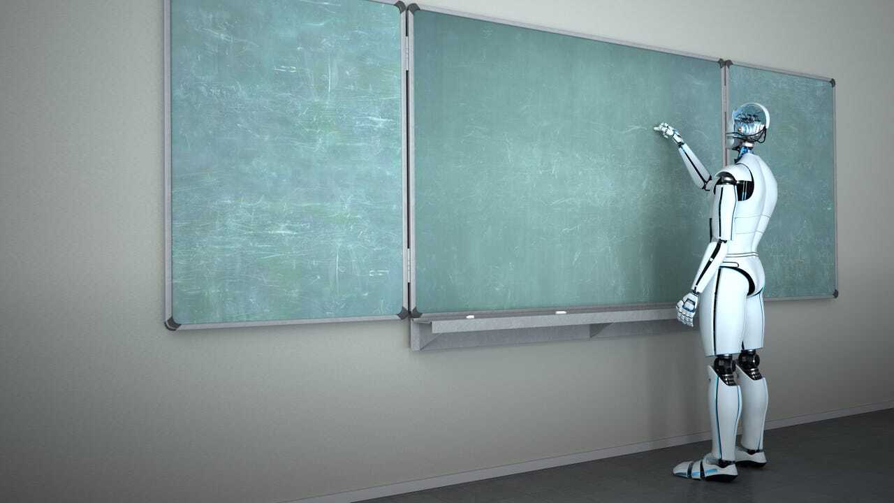 黒板に何かを書くロボット